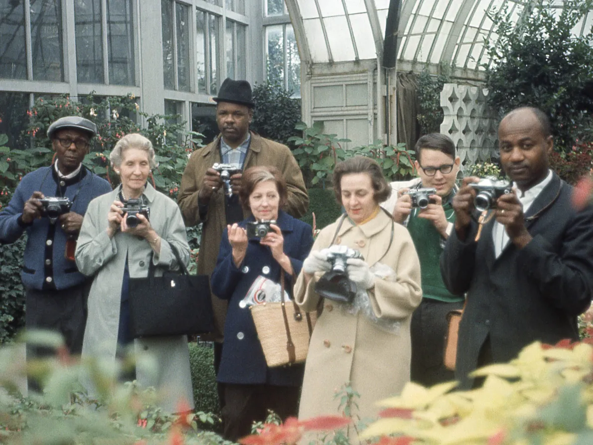 “Untitled (Group Portrait with Cameras, Belle Isle Conservatory, Detroit),” around 1970, attributed to Allen Stross, color transparency film. Detroit Institute of Arts