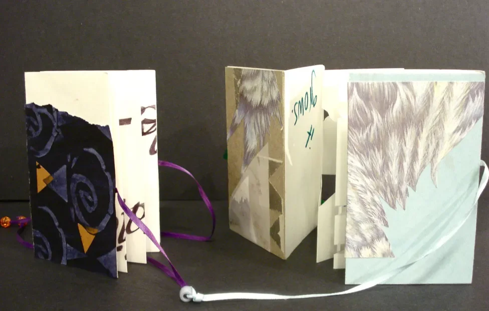 Accordion books made with paper and string on display