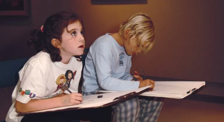 Two children drawing