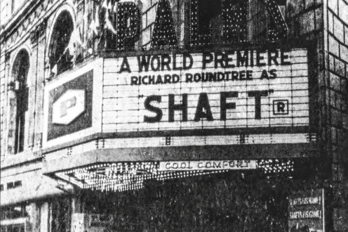 A theatre marquee with the words "A World Premiere, Richard Roundtree As Shaft."