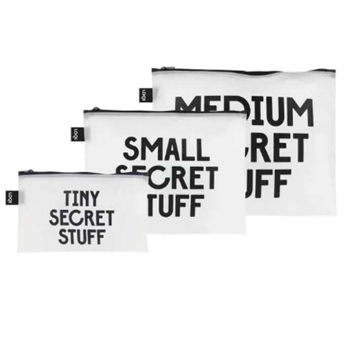 Three small zippered bags reading "Tiny Secret Stuff," "Small Secret Stuff," and "Medium Secret Stuff."